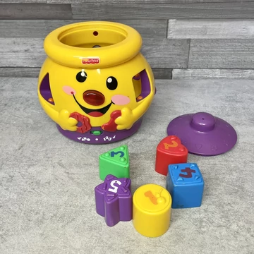 Fisher Price színes angol-magyar formabedobó fejlesztőjáték